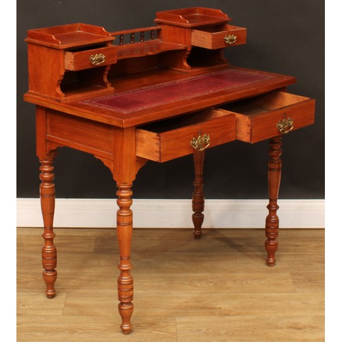 207 - A writing desk, shaped superstructure with two small drawers, rectangular top with inset tooled and ... 