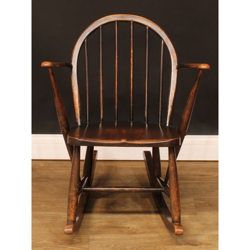 208 - A government austerity regulation approved Ercol F.182 Windsor rocking chair, stamped with the Board... 