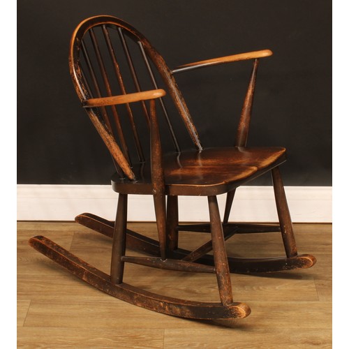 208 - A government austerity regulation approved Ercol F.182 Windsor rocking chair, stamped with the Board... 