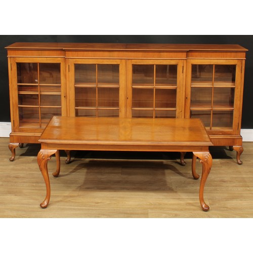 220 - A George II inspired walnut break-centre low library bookcase, 90.5cm high, 185cm wide, 36cm deep; a... 