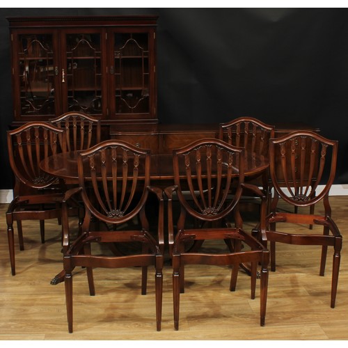 595 - A Strongbow Furniture dining suite, comprising bookcase, 176cm high, 132.5cm wide, 43.5cm deep, side... 