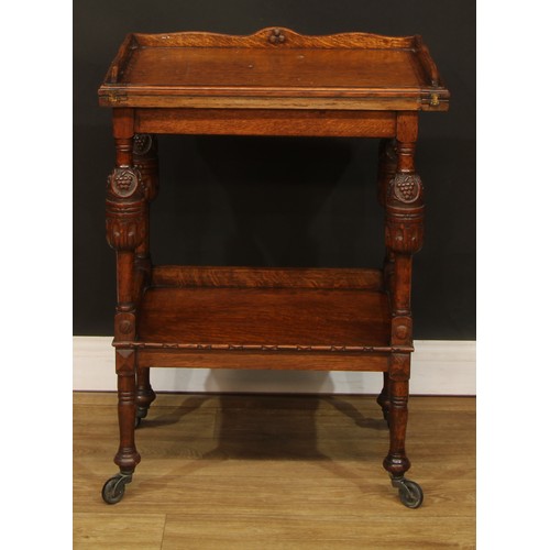 601 - An oak after-dinner or dessert combination serving trolley and card table, hinged top enclosing a ba... 