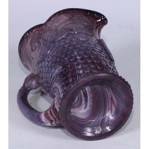 158 - A late 19th century pressed slag glass jug or vase, modelled in the form of a fish, the tail formed ... 