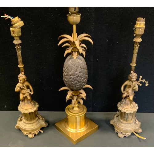 34 - A Maison Charles style gilt and bronzed metal pineapple table lamp, 51cm high;  a pair of cherub lam... 