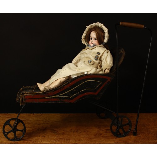 4037 - An August Steiner (Germany) bisque head and partly fixed ball jointed composition bodied doll, fixed... 