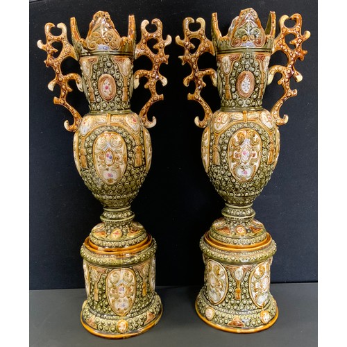 222 - A pair of 19th century Alhambrian majolica vases on stands. 61c, high