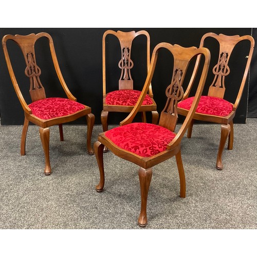 229 - A set of four early 20th century Art Nouveau mahogany dining chairs, carved Heart splat, drop-in sea... 