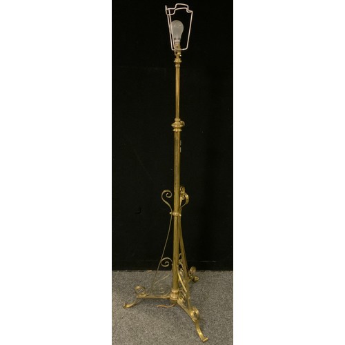 242 - An early 20th century brass rise-and-fall standard lamp.