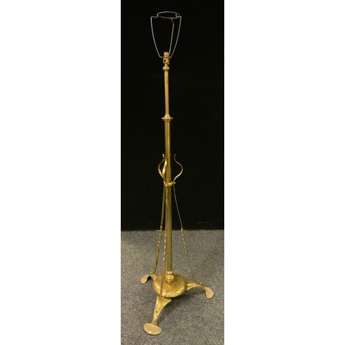 244 - An early 20th century brass rise-and-fall, Art Nouveau style standard lamp.