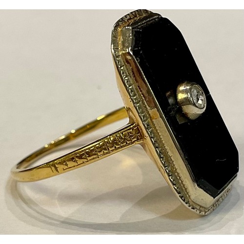 387 - An 18k gold mourning type jet and diamond ring, size Q, 5.5g, late 19th/early 20th century