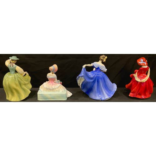 32 - A Royal Doulton figure, Daydreams HN1731; three others, Top O'The Hill HN1834, Buttercup HN2309, Ela... 