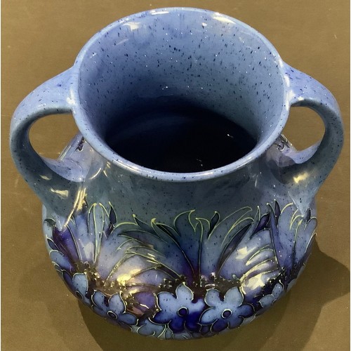 72 - A Moorcroft Cornflower two handled vase, c.1920, impressed mark, signed in blue, 20cm high