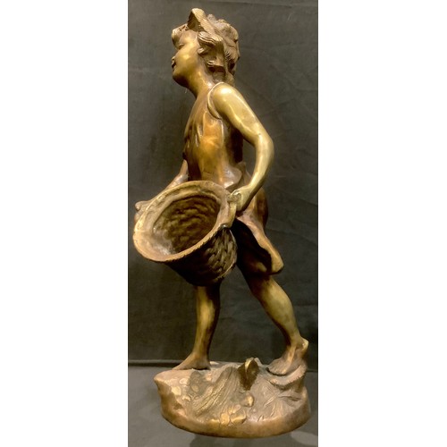 95 - A bronzed metal sculpture of a girl with basket, 43cm high