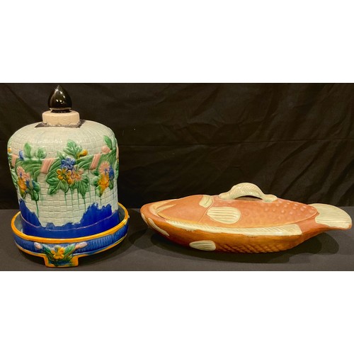 121 - A majolica cheese dome; a stoneware fish dish and cover (2)