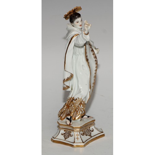 761 - A German porcelain figure, probably Meissen, of a saint, possibly Saint Dominic, modelled wearing th... 