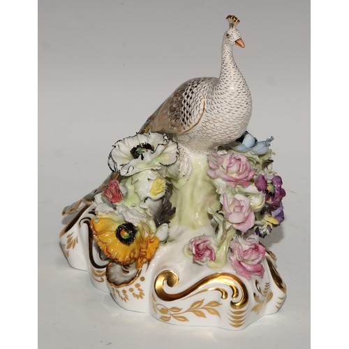 642 - A Royal Crown Derby model, of a peacock, 18cm high, green printed mark