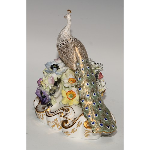 642 - A Royal Crown Derby model, of a peacock, 18cm high, green printed mark