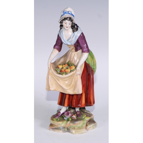 741 - A pair of Continental porcelain figures, fruit sellers, in the 18th century taste, 20.5cm high, blue... 