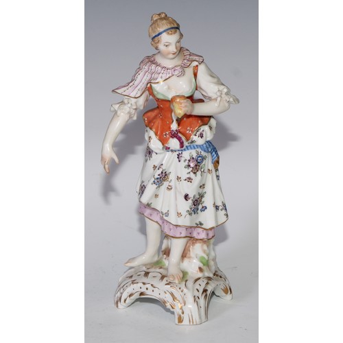 741 - A pair of Continental porcelain figures, fruit sellers, in the 18th century taste, 20.5cm high, blue... 