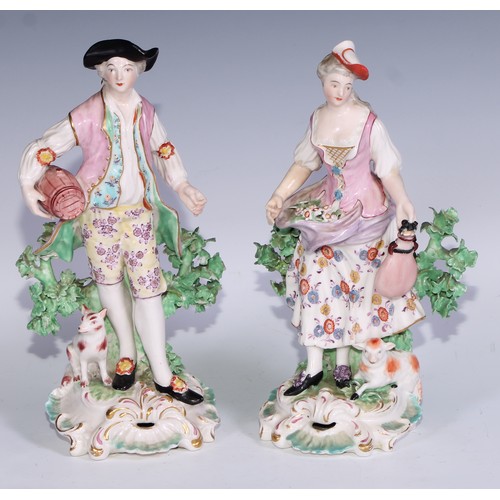 712 - A pair of Derby patch mark figures, of a beau and his lady, pierced scroll bases, he stands 26cm hig... 