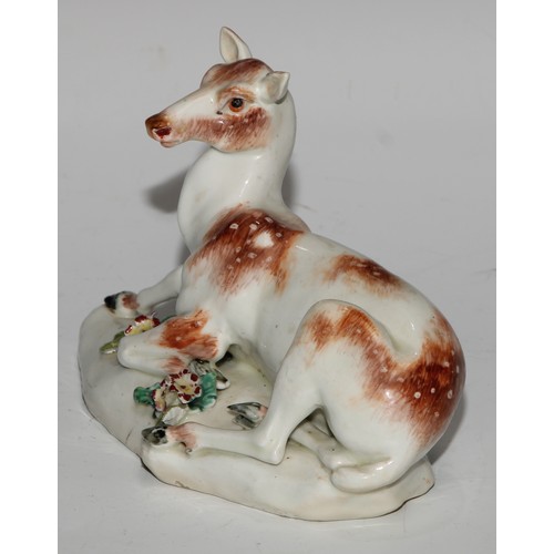 695 - A Derby patch mark model, of a doe, the shaped base applied with flowering boccage, 16cm long, c.177... 