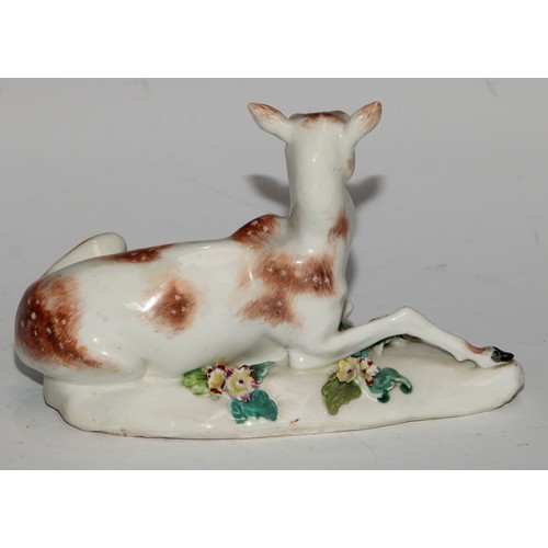 695 - A Derby patch mark model, of a doe, the shaped base applied with flowering boccage, 16cm long, c.177... 