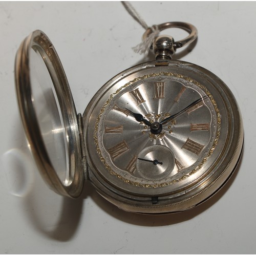 79 - A Victorian silver pocket watch, 5cm engine turned dial applied with gold coloured metal Roman numer... 