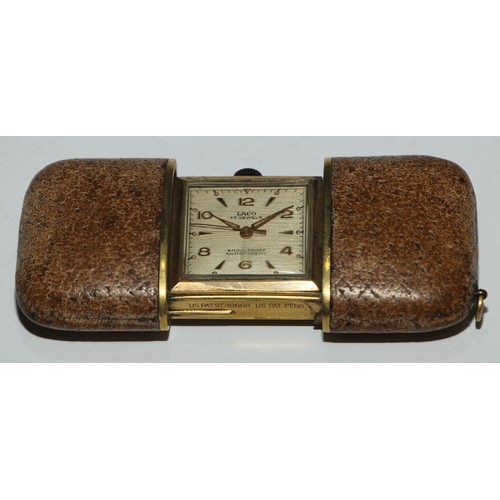 75 - A Swiss Art Deco silver purse watch, 2.25cm square dial inscribed Tivoli, Arabic numerals, subsidiar... 