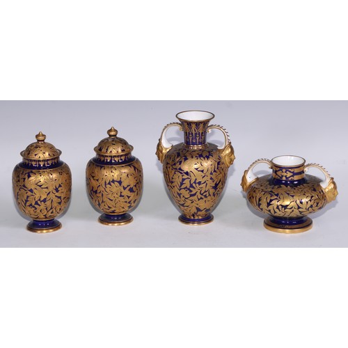 714 - A pair of Royal Crown Derby ovoid vases and covers, decorated in gilt with birds and butterflies amo... 