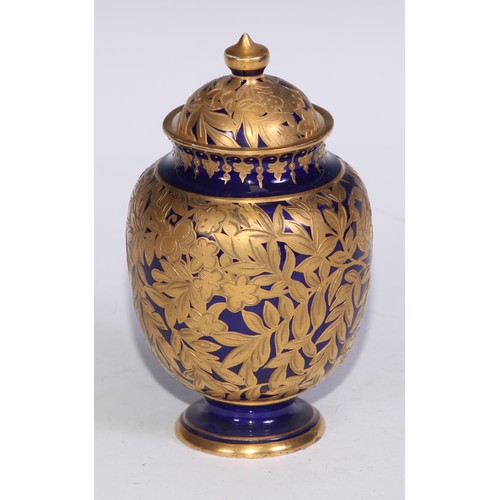 714 - A pair of Royal Crown Derby ovoid vases and covers, decorated in gilt with birds and butterflies amo... 