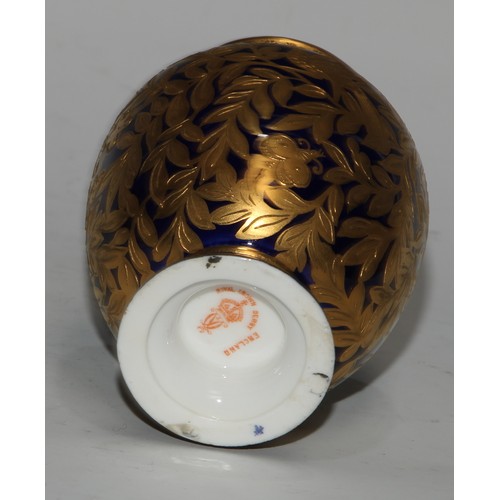 714 - A pair of Royal Crown Derby ovoid vases and covers, decorated in gilt with birds and butterflies amo... 