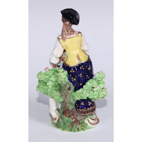 711 - A pair of Derby figures, Companion Gardeners, she with watering cans, he with a plant pot, the talle... 