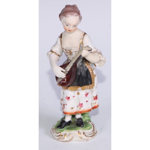 711 - A pair of Derby figures, Companion Gardeners, she with watering cans, he with a plant pot, the talle... 