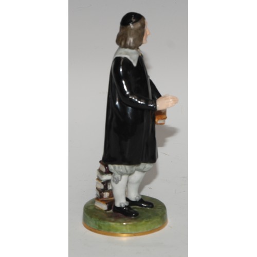 635 - A Royal Crown Derby figure, San Grada, modelled with his books, 17cm high, printed mark