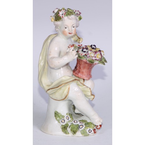 694 - A Derby patch mark figure, Spring, modelled as a putto garlanded with flowers and holding a nest of ... 