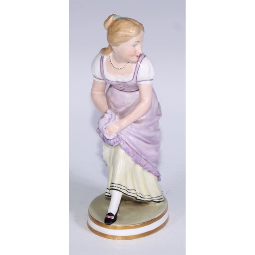 679 - A Derby figure, of a post-Regency lady of fashion, circular base, 20.5cm high, red crown over Derby ... 