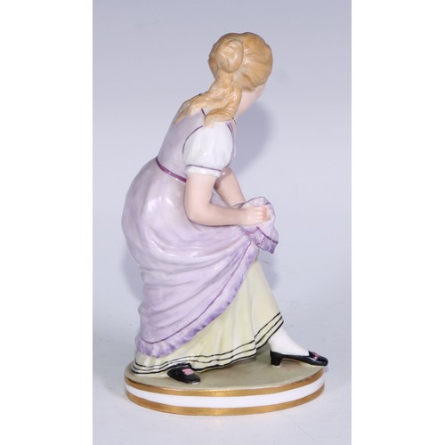 679 - A Derby figure, of a post-Regency lady of fashion, circular base, 20.5cm high, red crown over Derby ... 