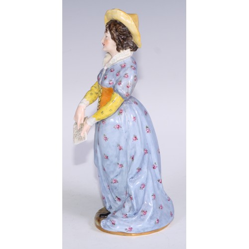 633 - A Royal Crown Derby figure, Mistress Page, from Shakespeare's Merry Wives of Windsor, she stands, ho... 