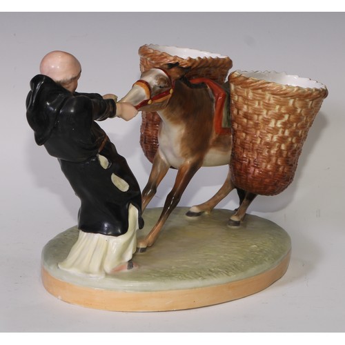 591 - A Derby Crown Porcelain figural sweetmeat stand, modelled as a friar and donkey, 28cm long, printed ... 