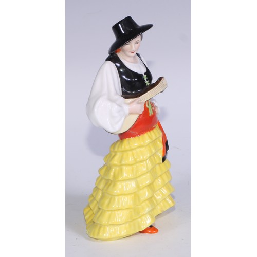 636 - A Royal Crown Derby figure, Spanish Duet, he stands wearing a black hat and and long cape, holding a... 