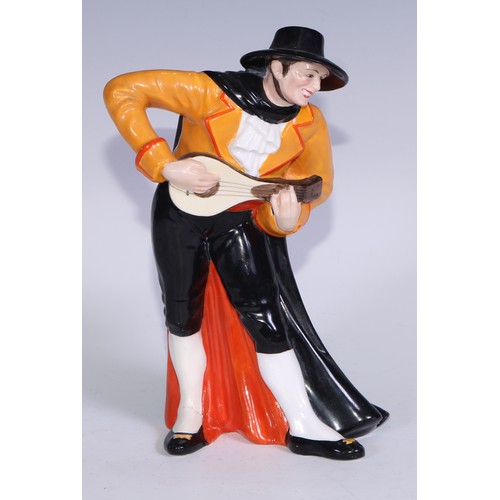 636 - A Royal Crown Derby figure, Spanish Duet, he stands wearing a black hat and and long cape, holding a... 