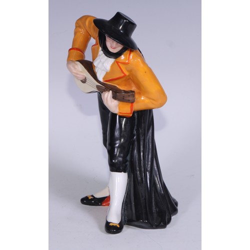 636 - A Royal Crown Derby figure, Spanish Duet, he stands wearing a black hat and and long cape, holding a... 