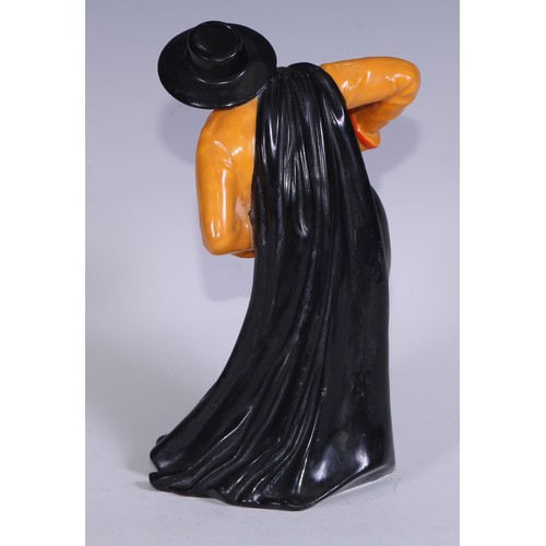 636 - A Royal Crown Derby figure, Spanish Duet, he stands wearing a black hat and and long cape, holding a... 