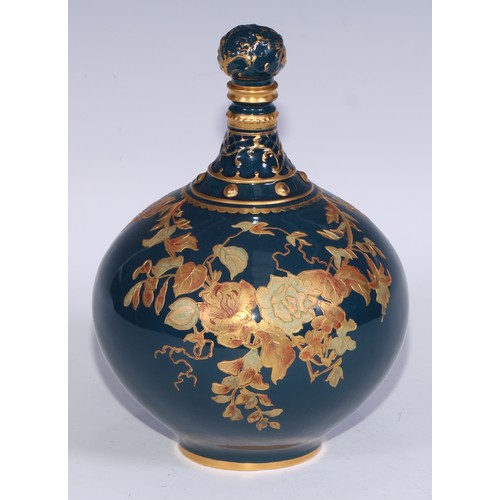 628 - A Royal Crown Derby compressed globular bottle vase and stopper, decorated in green and gilt with fl... 