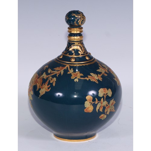 628 - A Royal Crown Derby compressed globular bottle vase and stopper, decorated in green and gilt with fl... 