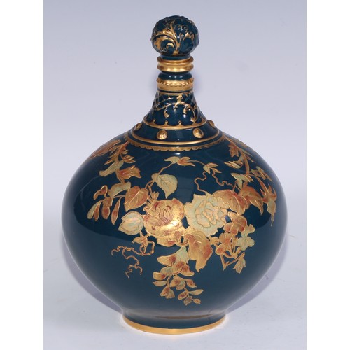 628 - A Royal Crown Derby compressed globular bottle vase and stopper, decorated in green and gilt with fl... 