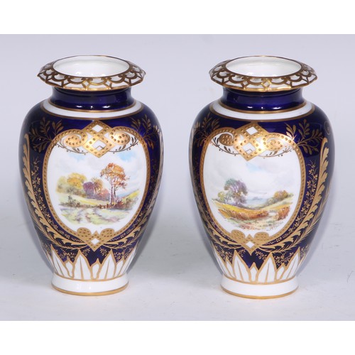 606 - A pair of Royal Crown Derby ovoid vases, painted by W E J Dean, signed, with extensive landscapes, i... 