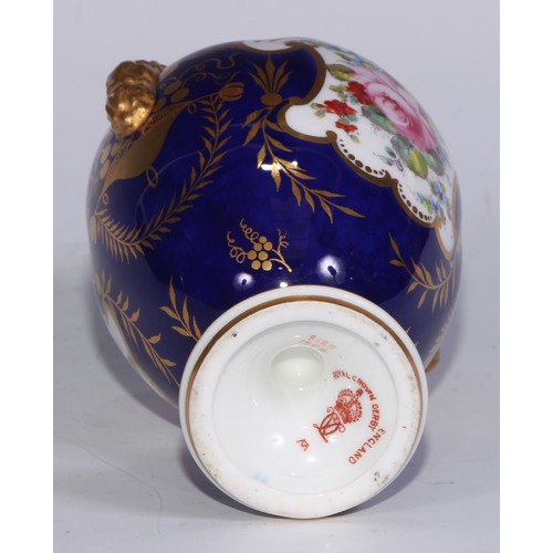 597 - A matched pair of Royal Crown Derby ovoid vases, of French form, painted with reserves of colourful ... 