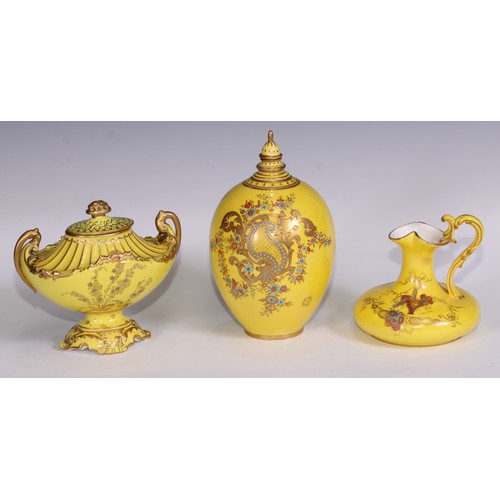 656 - A Royal Crown Derby two-handled boat shaped pedestal vase, moulded and decorated in gilt on a yellow... 