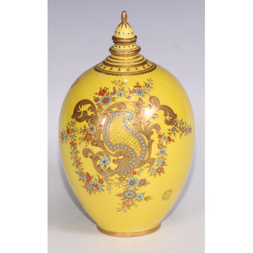 656 - A Royal Crown Derby two-handled boat shaped pedestal vase, moulded and decorated in gilt on a yellow... 